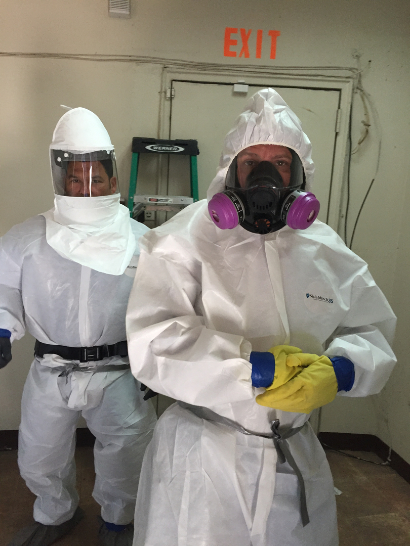 Asbestos abatement professionals at work